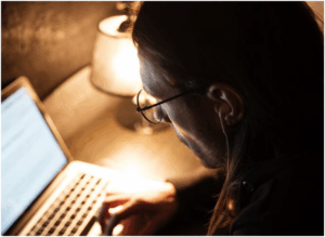 Reviewing a hotel on a laptop