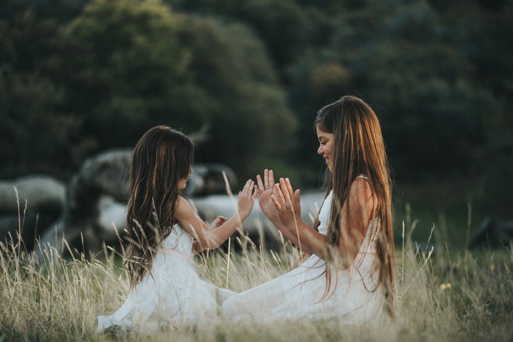 Girls playing on a meadow
