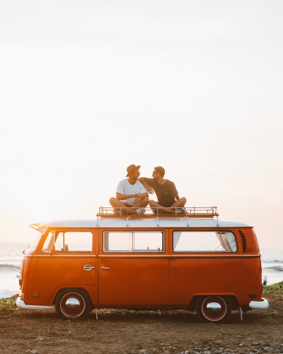 Friends sitting on a van