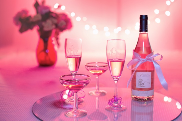 A bottle of rose wine and glasses