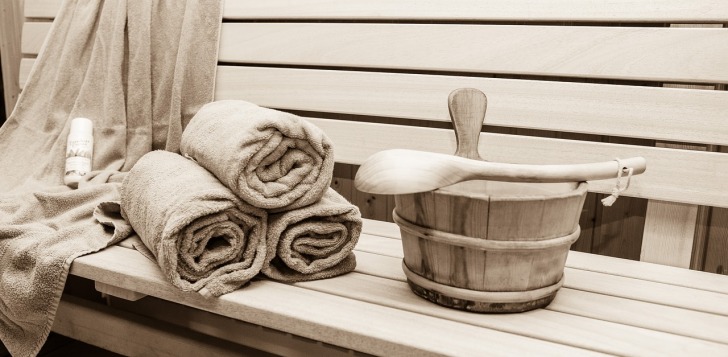 Towels and cold water in a sauna