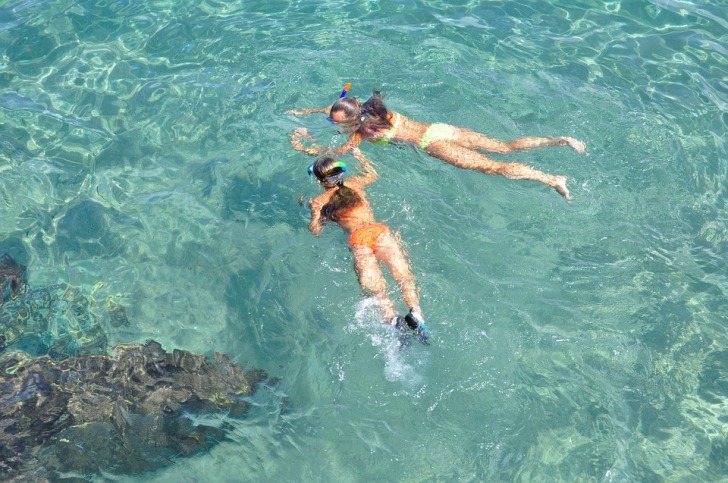 Two girls snorkeling