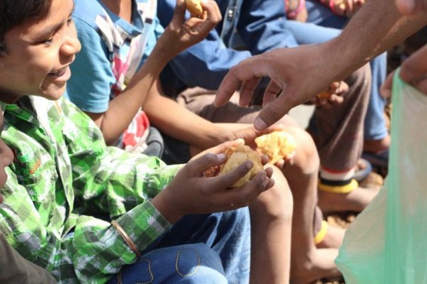 Giving food to hungry kids
