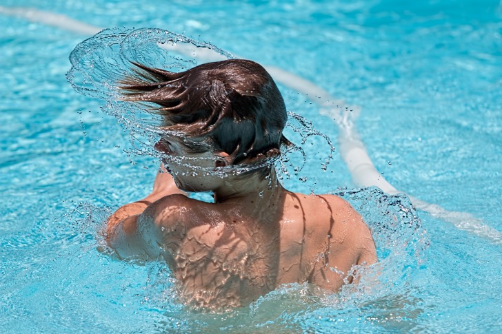 A boy in a swimming pool