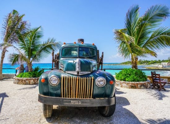 Old car by the beach