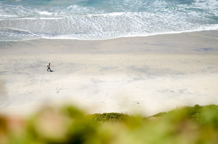 Man walking on San Diego beach