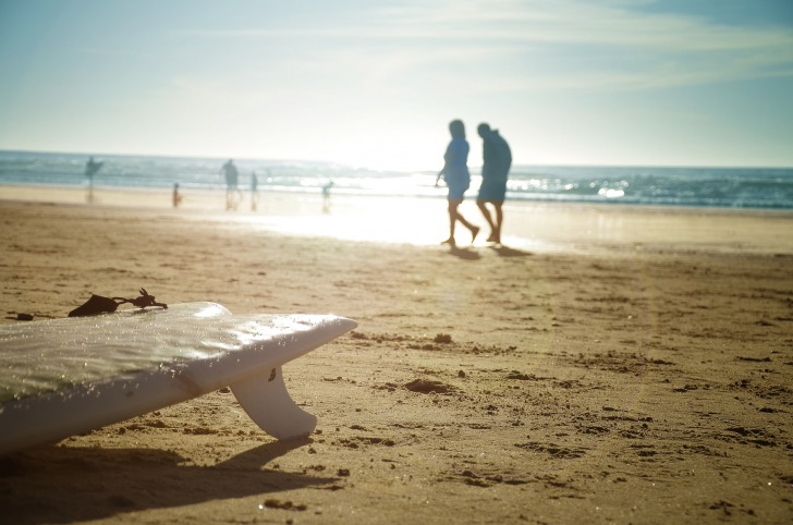 A couple walking on the beach