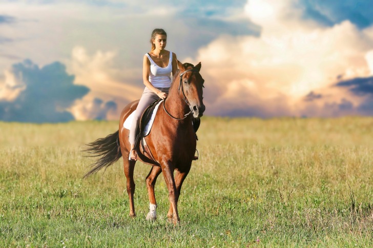 A girl riding a horse