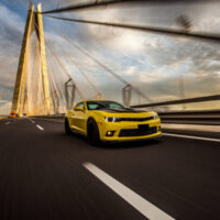 Yellow sport car with black autotuning bridge