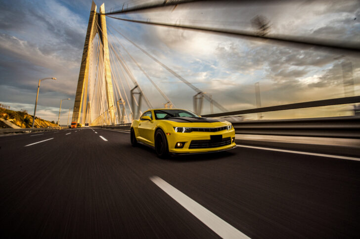 Yellow sport car with black autotuning bridge