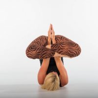 Blond woman in yoga position