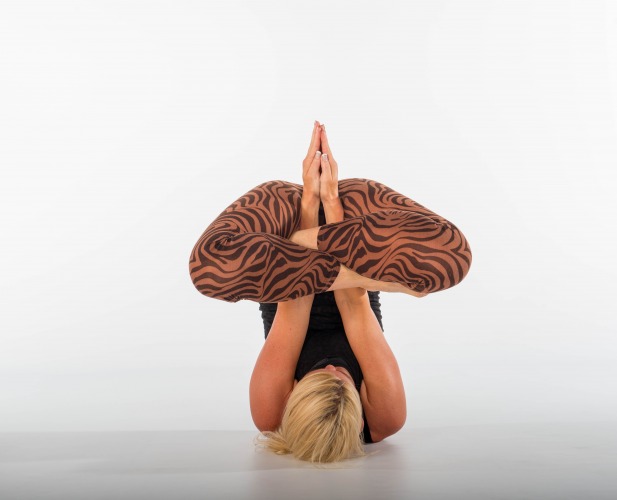 Blond woman in yoga position